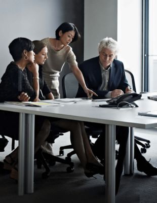 Executives around a conference room table